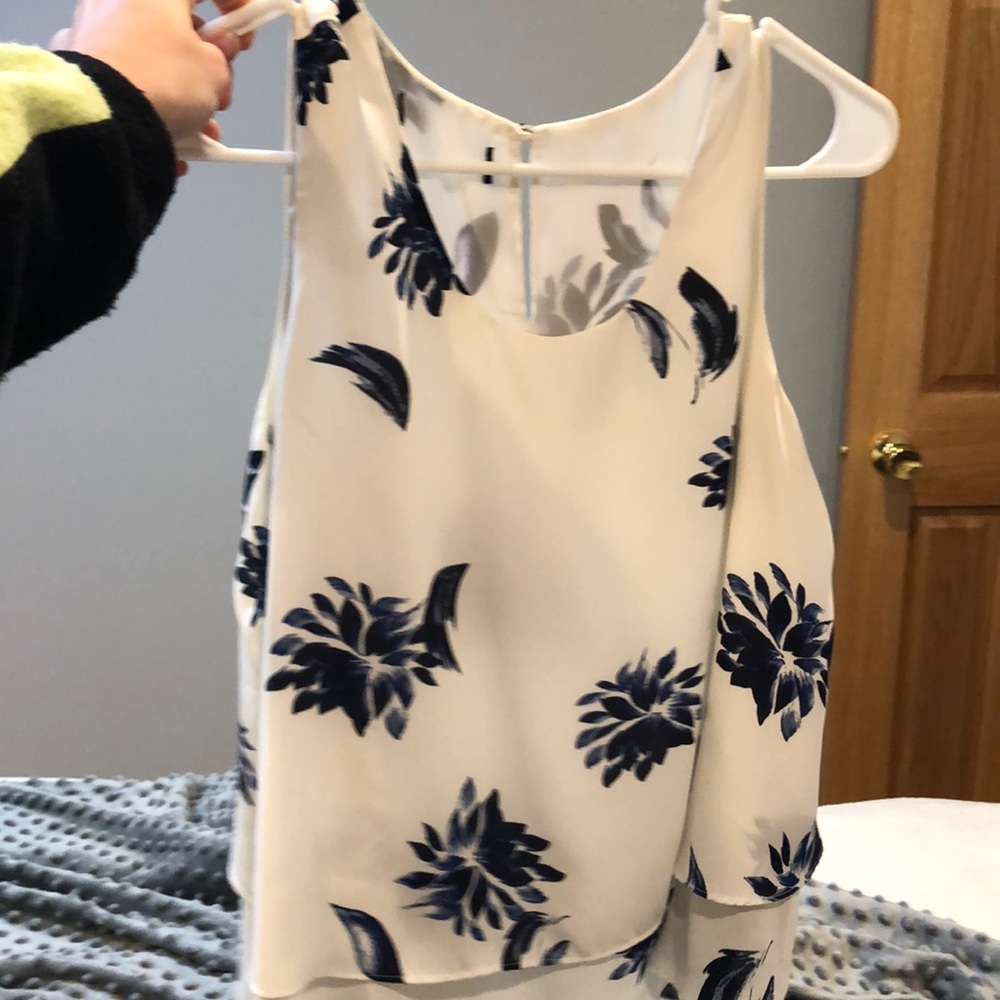 White top with blue flowers